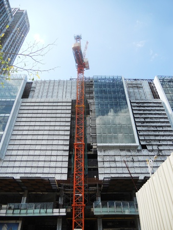 Skyscraper construction 4, a crane working on the contruction of a modern skyscraper, Kuala Lumpur, Malaysia, Asiaの写真素材