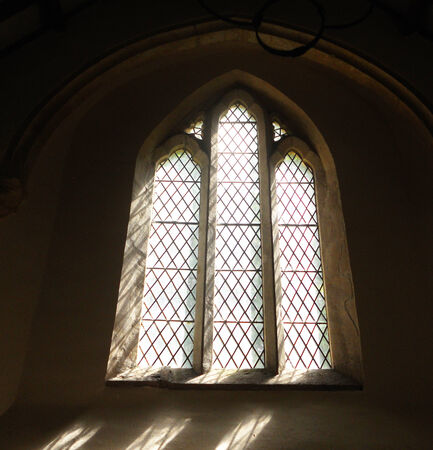 ancient church window 2, small church window in a sunny 12th Century Church interiorの写真素材