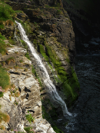 waterfall Tintagel  small waterfall down the cliff at Tintagel, Cornwall, UKの写真素材