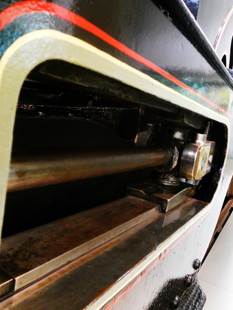 Steam train closeup showing piston-rod