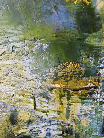 complex paint texture in greens, yellows and bluesの写真素材