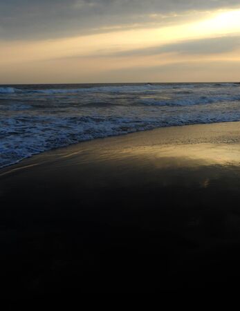 Black sand beach sunsetの写真素材