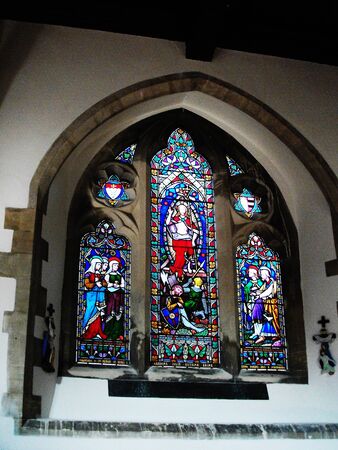 beautiful ancient stained glass window in a historic English churchのeditorial素材