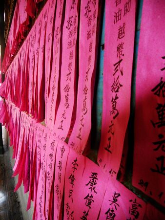 Chinese religious symbols on red paper, Chinese temple, Vietnamのeditorial素材