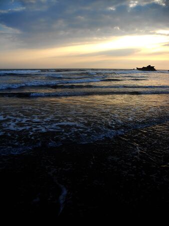 Black sand beach sunsetの写真素材