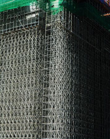 Skyscraper construction with scaffoldingの写真素材