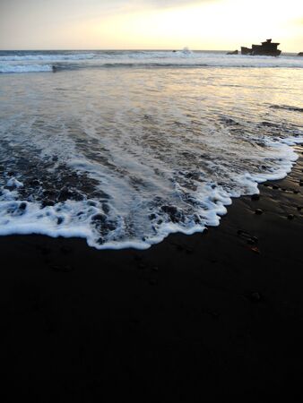 Black sand beach sunsetの写真素材