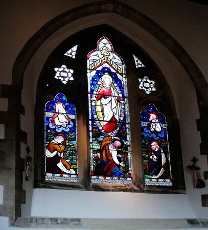 beautiful ancient stained glass window in a historic English churchのeditorial素材