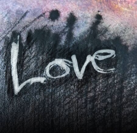 love painted, the word love hand-painted, artistic word love, pale lettering on dark texture.の写真素材