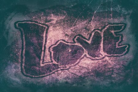 love painted, the word love hand-painted with outset border, artistic word love on dark grunge texture with dark vignette.の写真素材