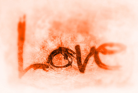 love painted, the word love hand-painted, artistic word love, stylized design element, orange grunge texture with blur vignette.の写真素材