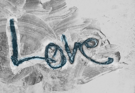 love painted, the word love hand-painted, artistic word love, hand-drawn lettering with blue tine on gray painted grunge texture.の写真素材