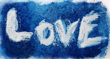 love painted, the word love hand-painted, artistic word love, rough-painted pale lettering on blue...