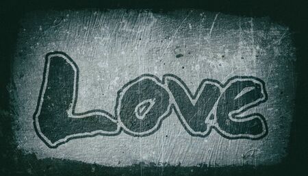 love painted, the word love hand-painted, artistic word love, gray brush lettering with outline on grunge texture with dark vignette.の写真素材