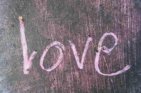 love painted, the word love hand-painted, artistic word love, hand-drawn lettering scratched into...