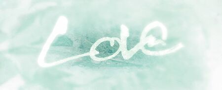 love painted, the word love hand-painted, artistic word love, rough painted brush lettering on painted organic texture, cyan tint, blur vignette.の写真素材