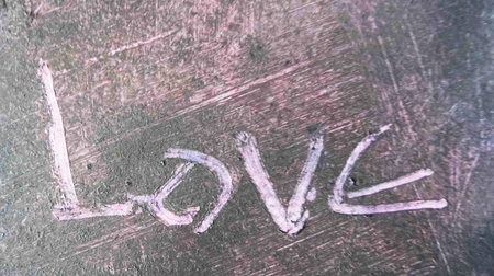 love painted, the word love hand-painted, artistic word love, hand-drawn lettering scratched into painted texture.の写真素材