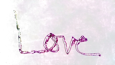 love painted, the word love hand-painted, artistic word love, rough hand-drawn lettering with colored textured border on pale painted background texture.の写真素材