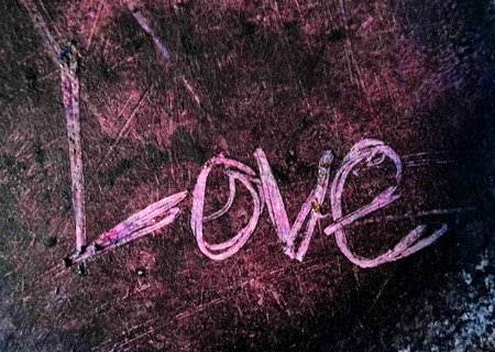 love painted, the word love hand-painted, artistic word love, hand-drawn lettering scratched into dark painted texture.の写真素材