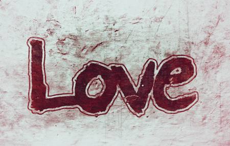 love hand-written, the word love written by hand, artistic word love, outlined brush lettering on, stone texture background, red and cyan tints.の写真素材