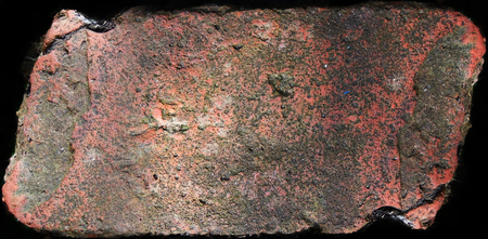 Rough old brick surface texture, on black background, distressed surface texture, warm colors.の写真素材