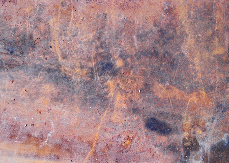 fascinating and complex red rusty metal texture with scratches and patches of dark and pale colors.の写真素材