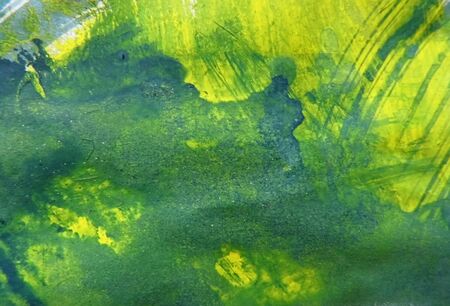 Artistic texture background with rough dry paint brush strokes on paper, random marks, green and...