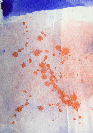 Paint splashes and texture, splashed watercolor on pale watercolor texture on watercolor paper, orange and blue.の写真素材