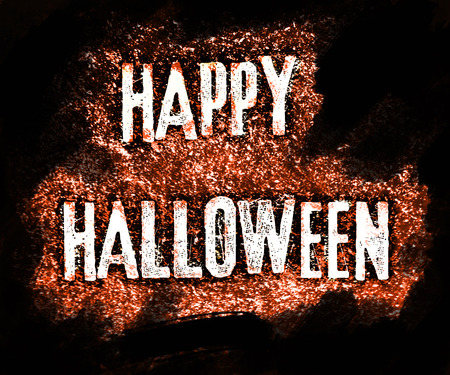 Happy Halloween grunge style lettering with a contemporary font, on rough chalk texture, with orange tints.の写真素材