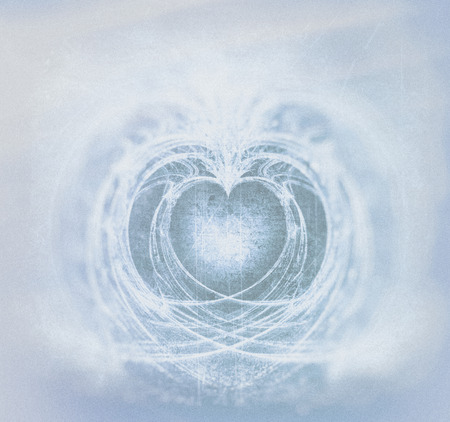 Grunge fractal heart art, a processed symmetrical fractal heart shape with grunge textures and scratches, blue tints plus vignette blur.の写真素材