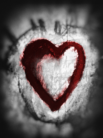 Smudged heart, a heart shape drawn roughly with smudged pastels, with paint splashes, black with red tints, with vignette blur.の写真素材