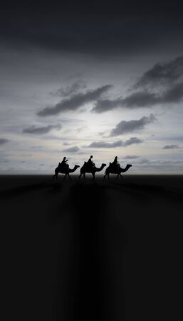Three Kings Christmas card with the 3 wise men on camels on a simple desert landscape with shadows 3D image, with a real sunset, tall, grays.の写真素材