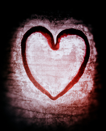 Rough painted heart-shape on rough surface.の写真素材