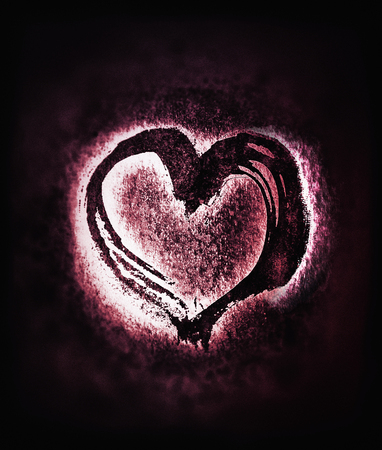 Rough painted heart shape on a rough surface. Blurred background.の写真素材