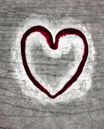 Rough painted heart-shape on rough surface.の写真素材