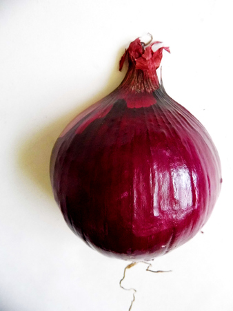red onion halved, showing the outside.の写真素材