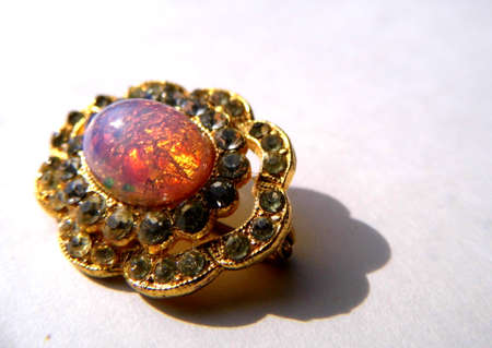 Gold brooch with opal and small stones.の写真素材