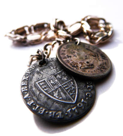 A silver bracelet with old coins, closeup,の写真素材