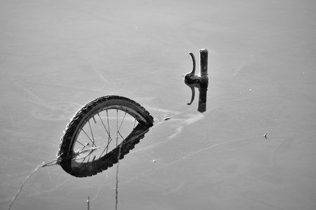 Bike sunk info the river in Tuscanyの写真素材