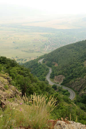 Mountain landscape with a car roadの写真素材