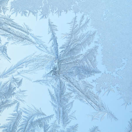 Frosen glass patterns of a winter windowの写真素材