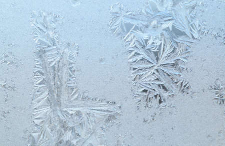 Frosen glass of a window in a cold winter dayの写真素材