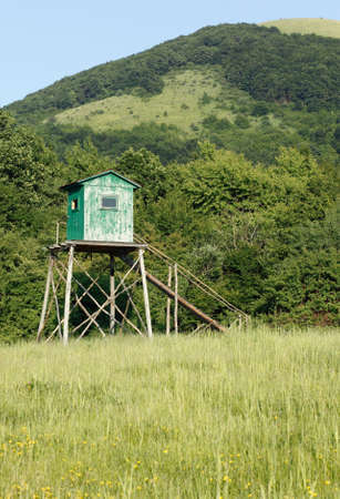 Shooting lodge in the mountains at late afternoonの写真素材