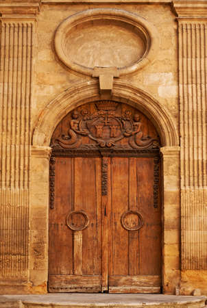 Old wooden door with ornaments in Aix en Provence, Franceの写真素材