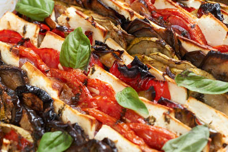 Oven-baked mediterranean french gourmet dish with vegetables and camembert cheeseの写真素材