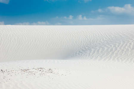 Desert scenery with white quartz sand and blue skyの写真素材