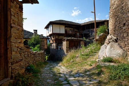 Street with old houses in Kovatchevitsa village, Bulgariaの写真素材