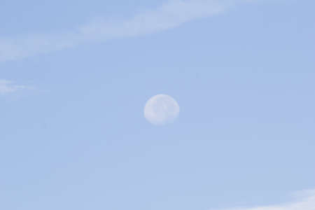 blue sky with white cloud and moonの写真素材