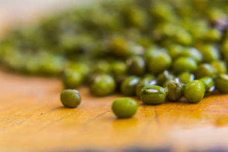Green bean or mung bean background with crack woodの写真素材
