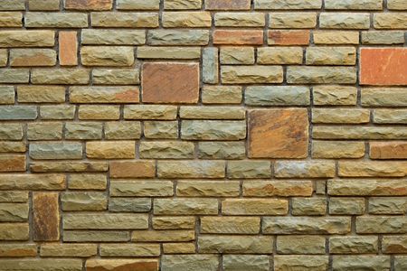 Brick wall background with multi-colored bricks	